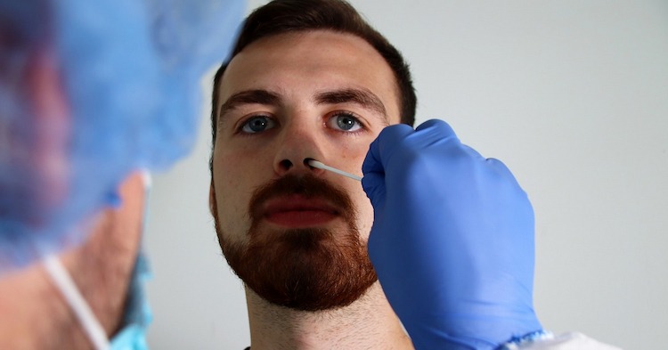 Swabbing for a PCR test for a fit to fly certificate in Manchester